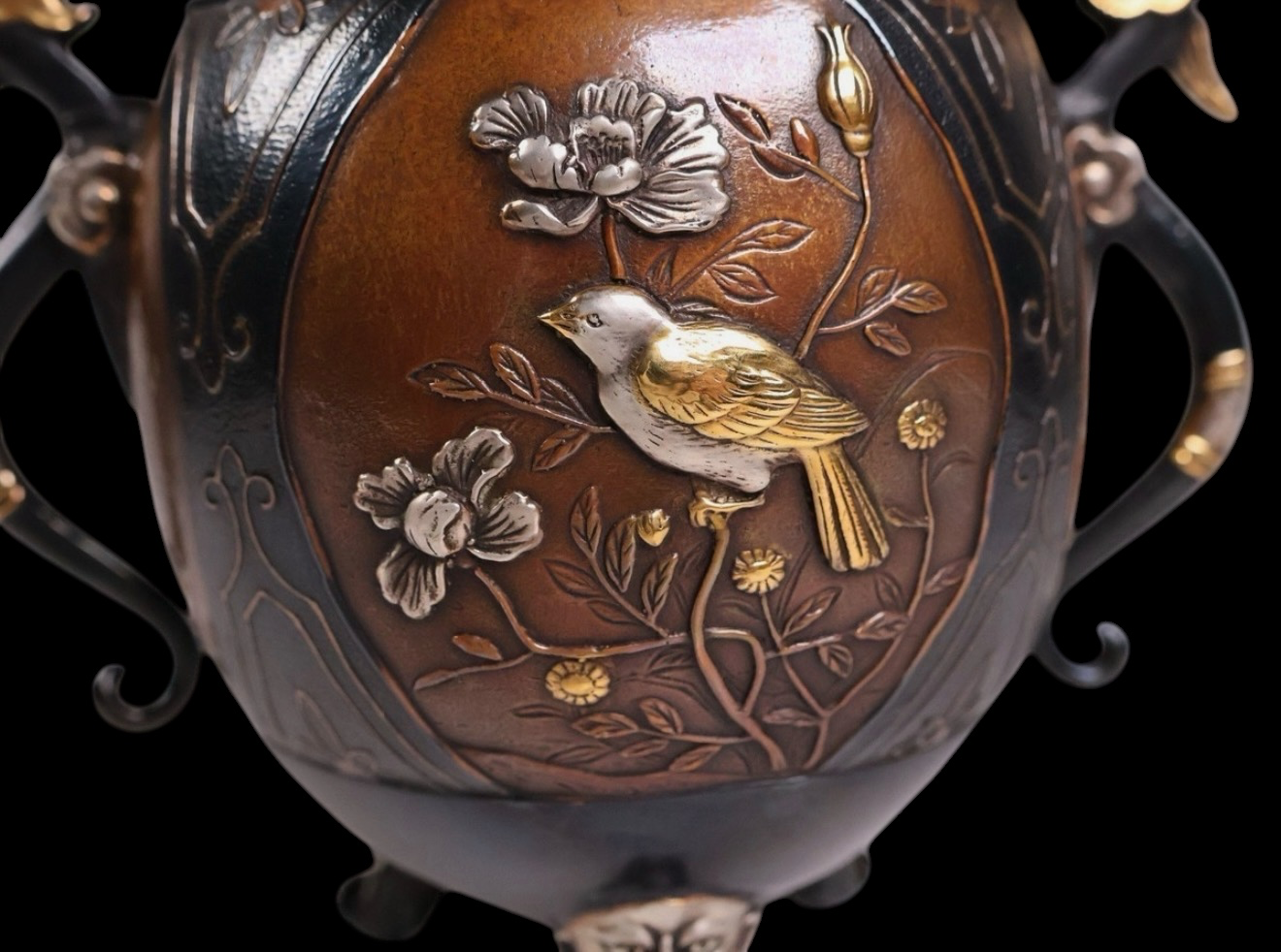 Close-up Takaoka bronze koro, bird and flowers with gold and silver inlay, katana aesthetic