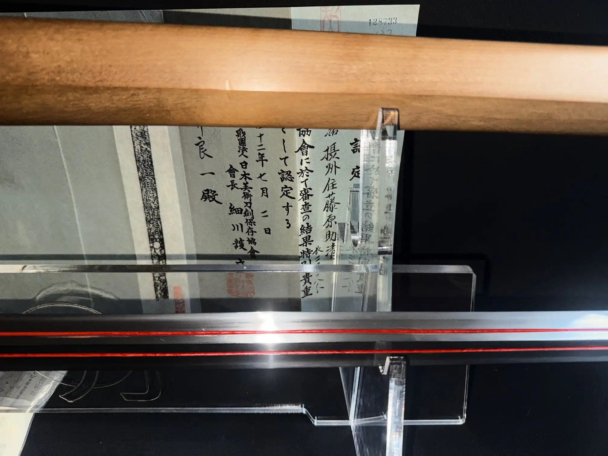 Kyodai Originals Ōmi Yari Sukekiyo Naginata in display case with certification, horizontal view