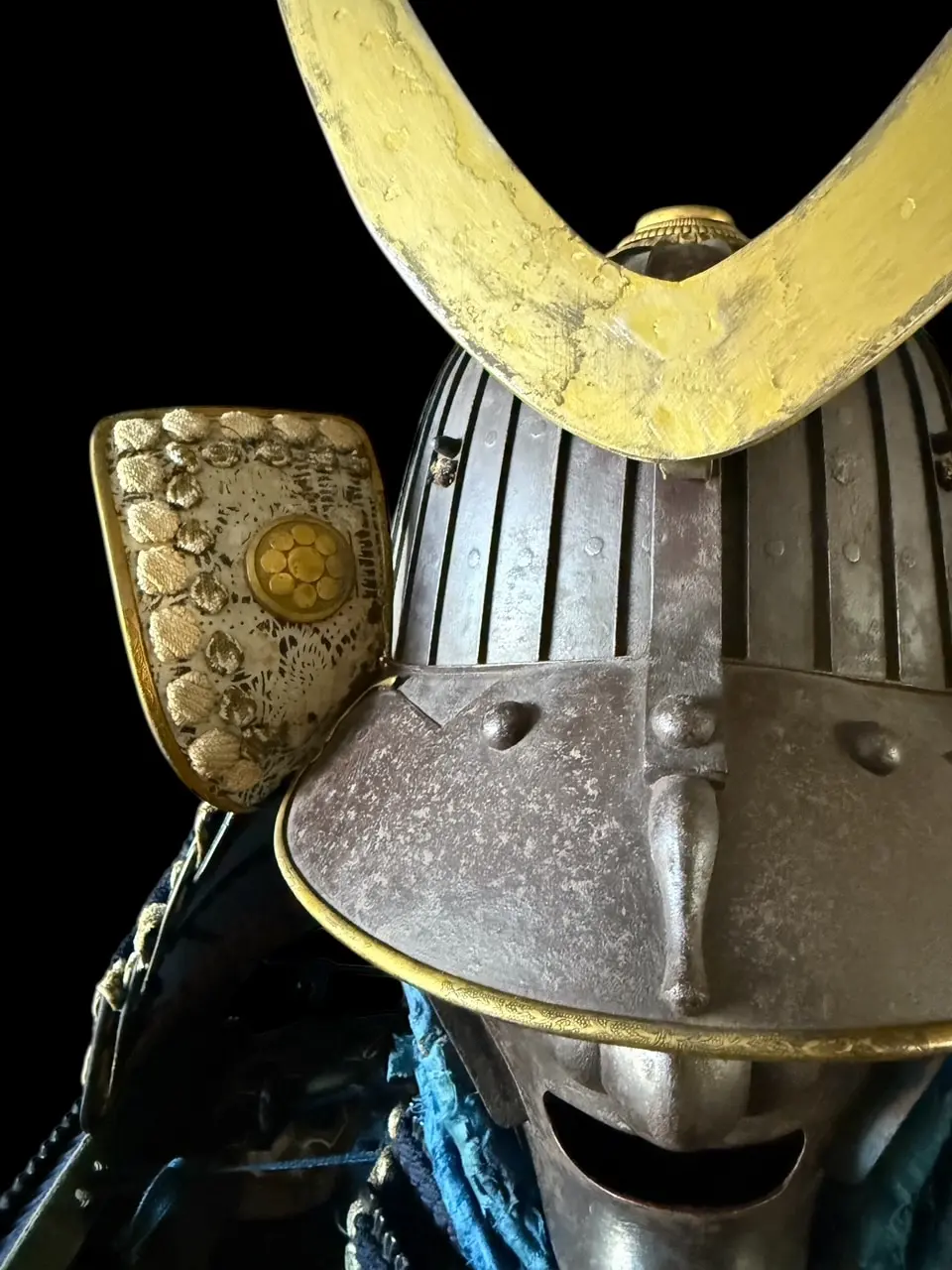 Close-up of a Mogami Dou Gusoku Armor helmet, Edo Period Samurai Armor with black lacquer finish and golden accents