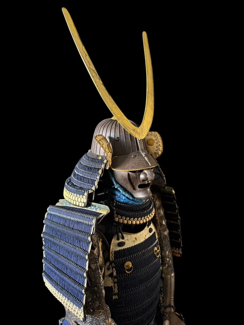 Edo-Period Mogami Dou Gusoku Armor, side view, with golden crest and black lacquered iron panels