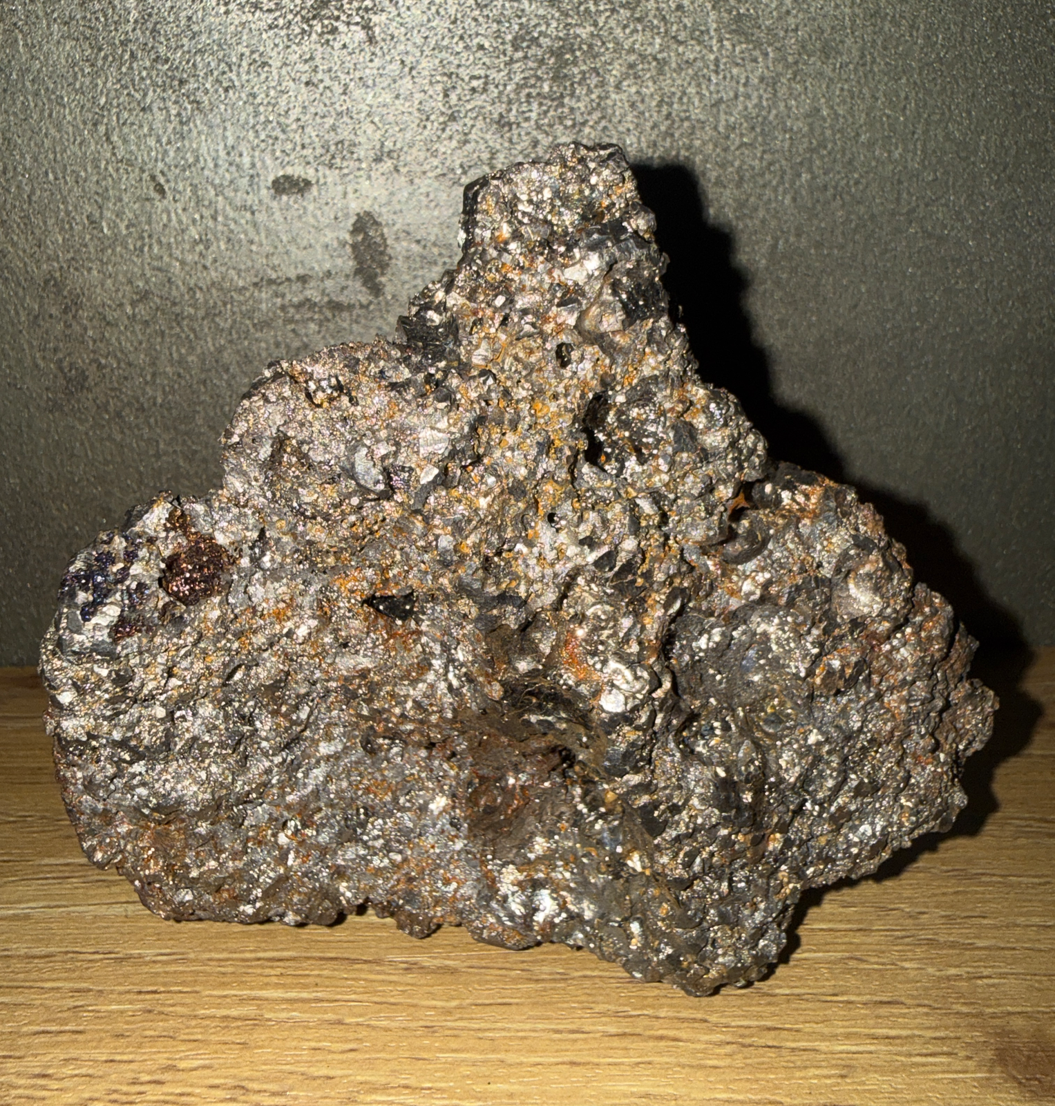 A 1.361 kg piece of authentic Japanese Tamahagane Steel, a tatara sword steel accessory, on wood background