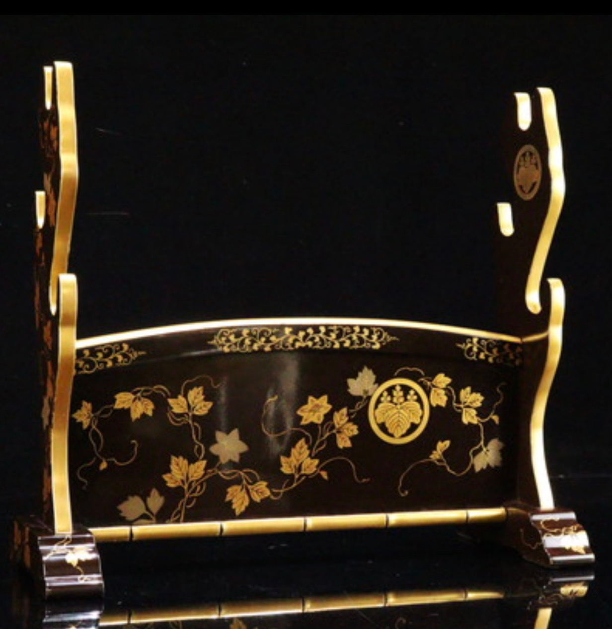 Antique Japanese Three-Sword Kake katana stand, black lacquer with gold maki-e paulownia mon design, front view