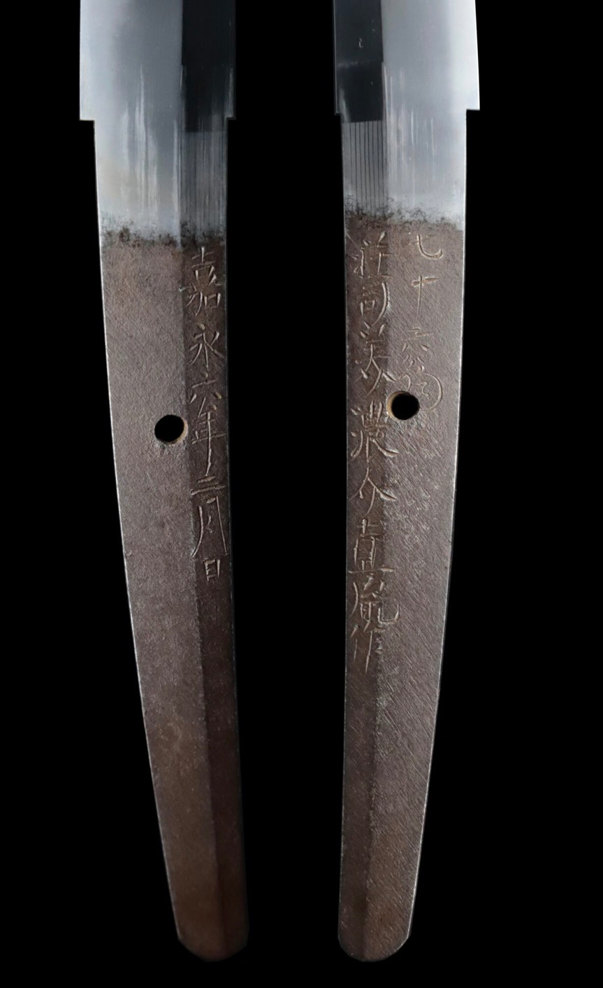 Pair of Taikei Naotane’s Final Known Daishō katana tangs with engraved inscriptions and peg holes