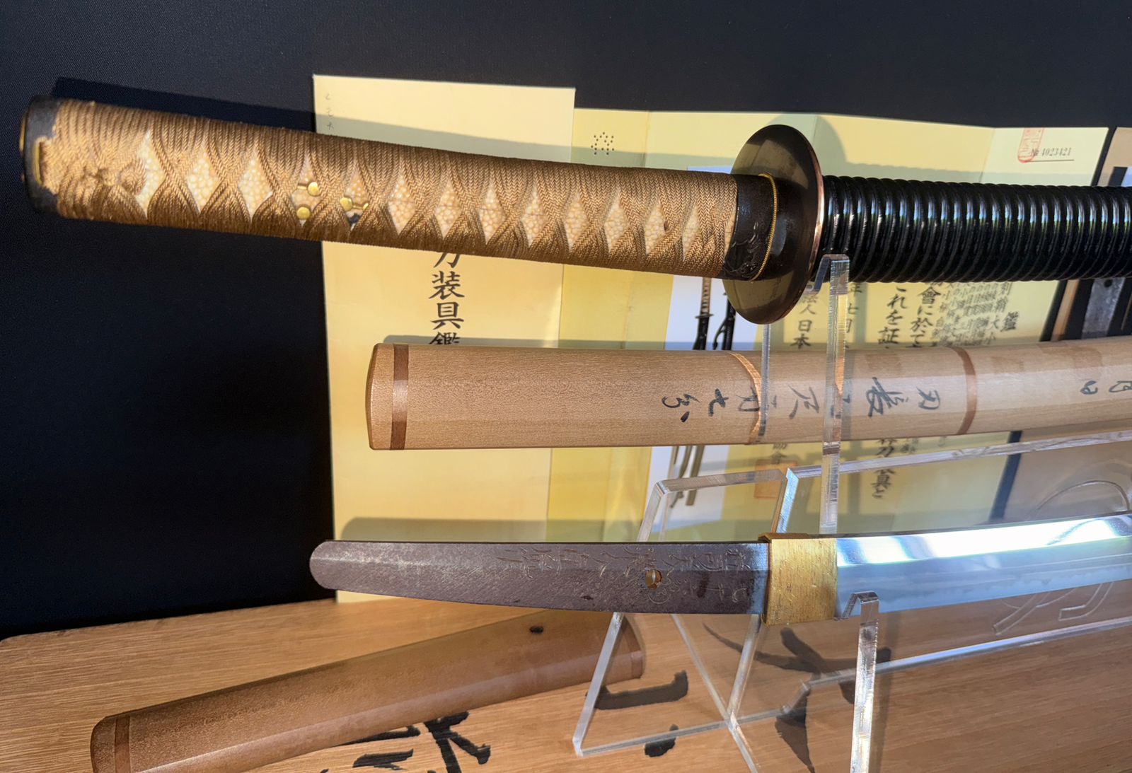 Close-up of Naotane's Final Known Daishō katana, showing handle and scabbard details, blade partial view