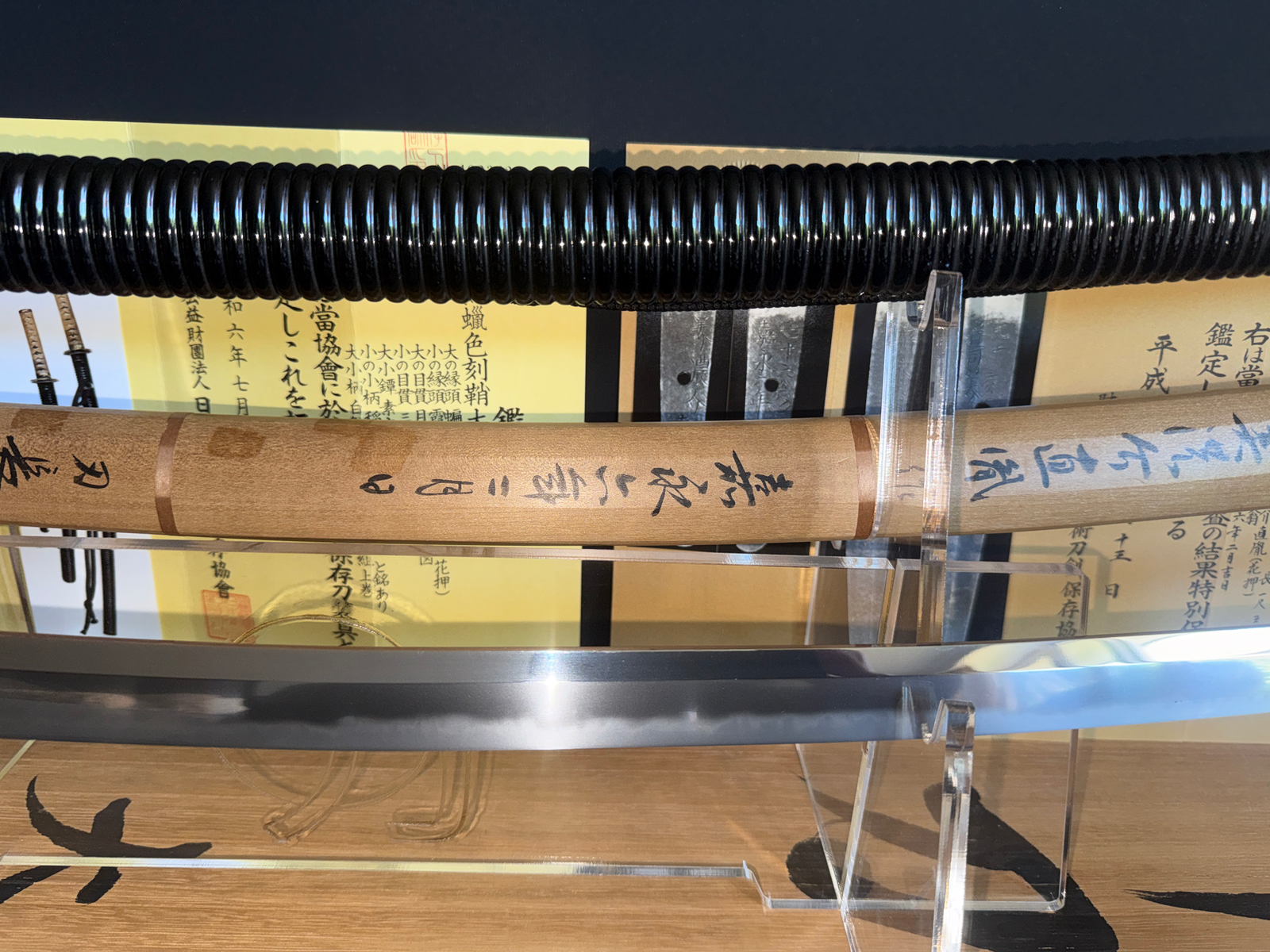 Naotane’s Final Known Daishō katana, with highly polished blade, visible hamon, and wooden scabbard