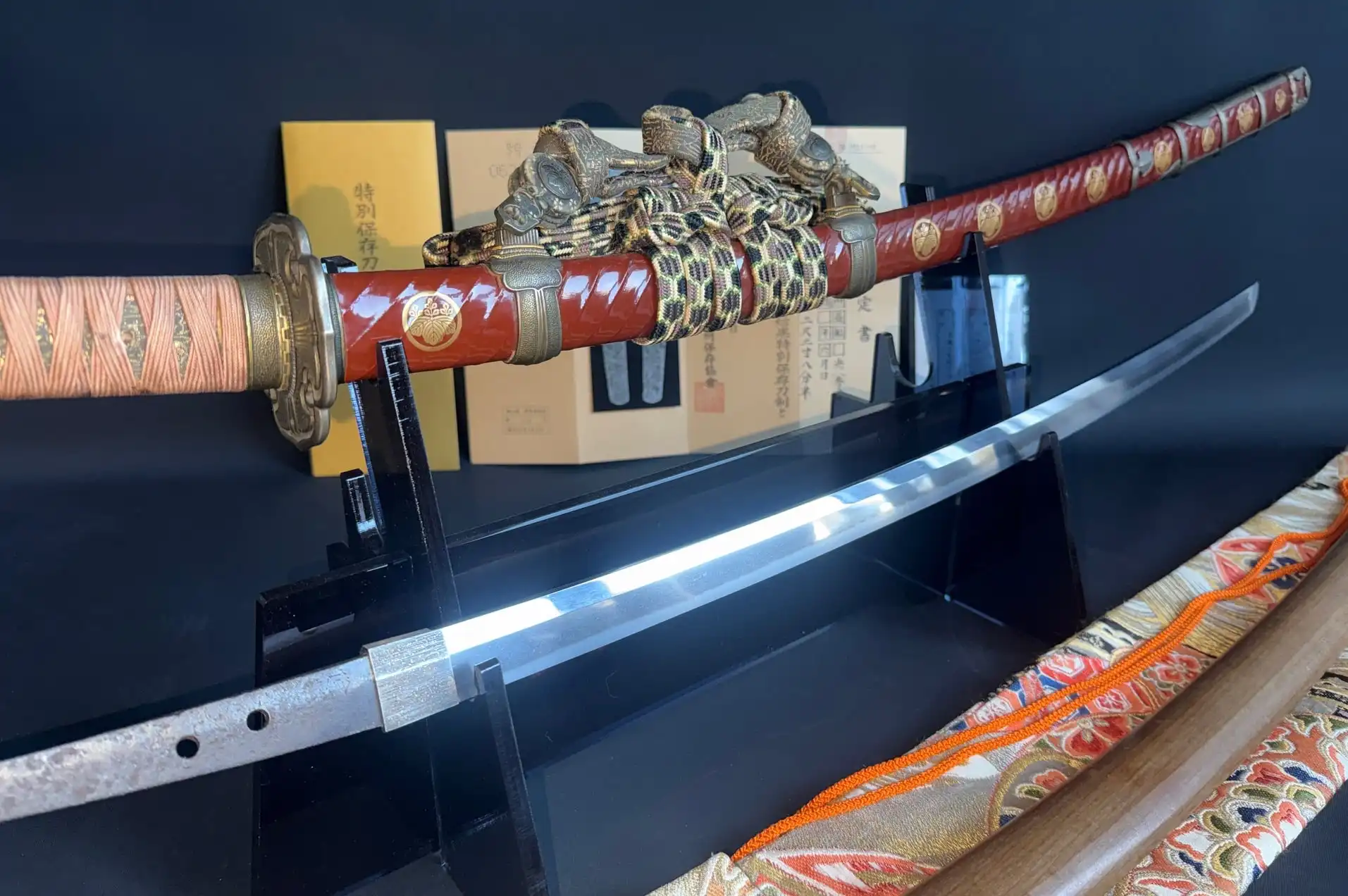 Nanbokuchō Tachi Hidemitsu katana, blade and scabbard with golden accents and sageo, displayed at an angle