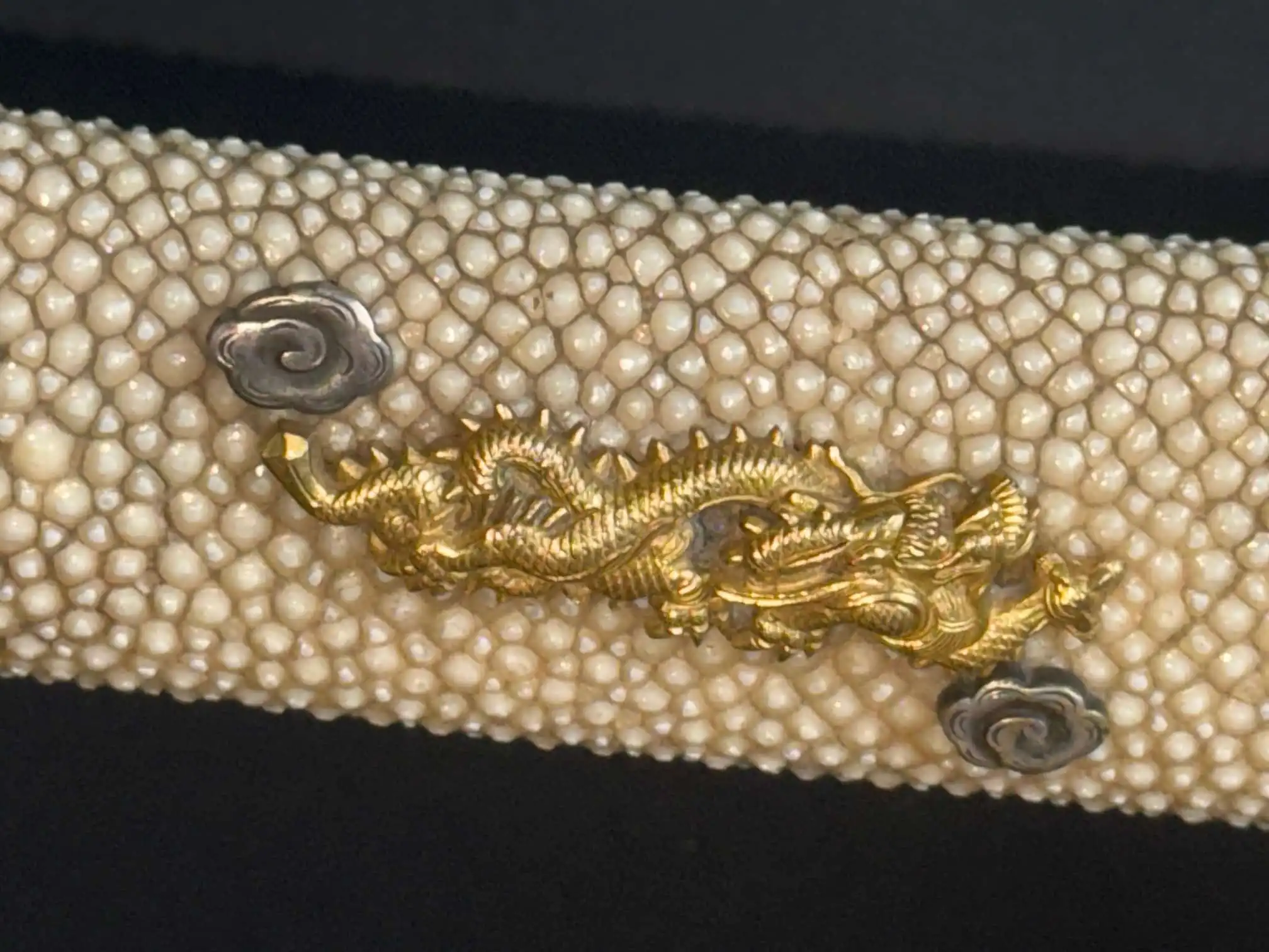 Close-up of golden dragon menuki on stingray skin handle for Katana Tachi Yokoyama Sukekane