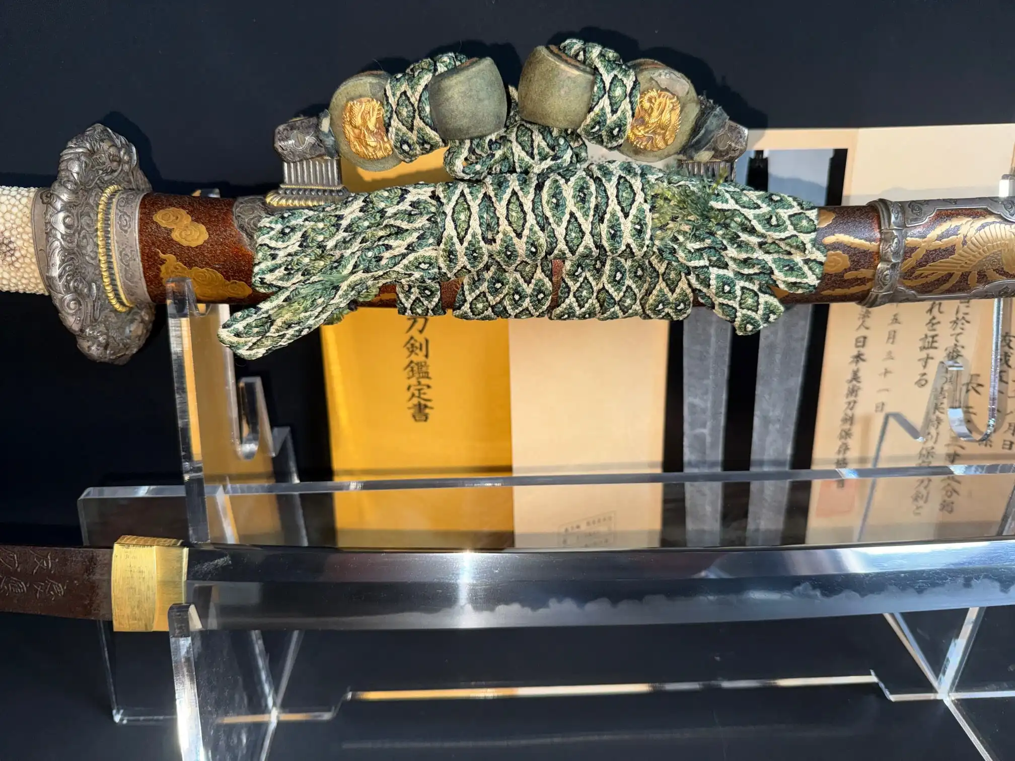 Tachi Yokoyama Sukekane katana with ornate hilt and polished blade on display