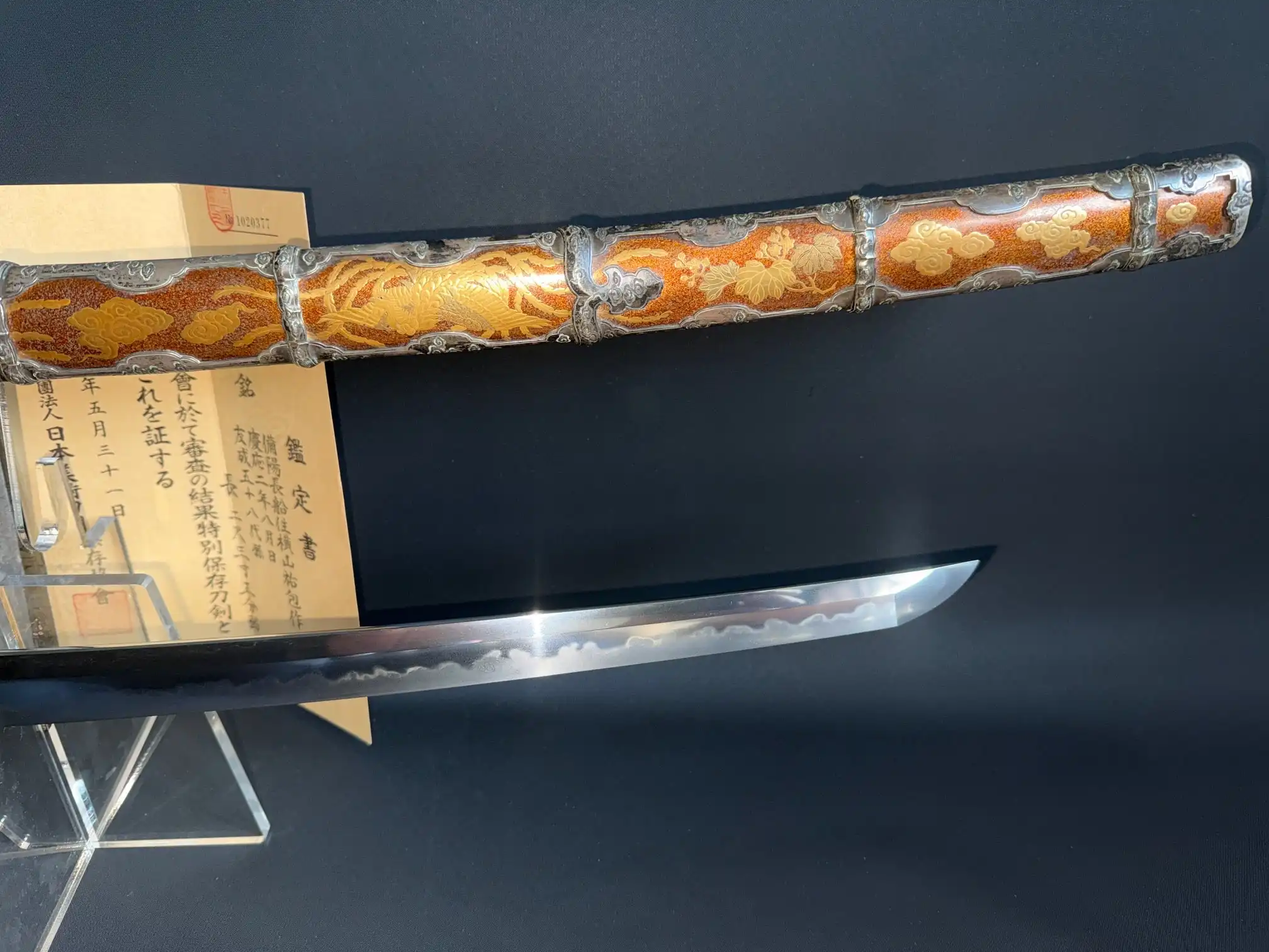 Ornate saya and gleaming blade of Kyodai Originals Tachi Yokoyama Sukekane Katana with certification