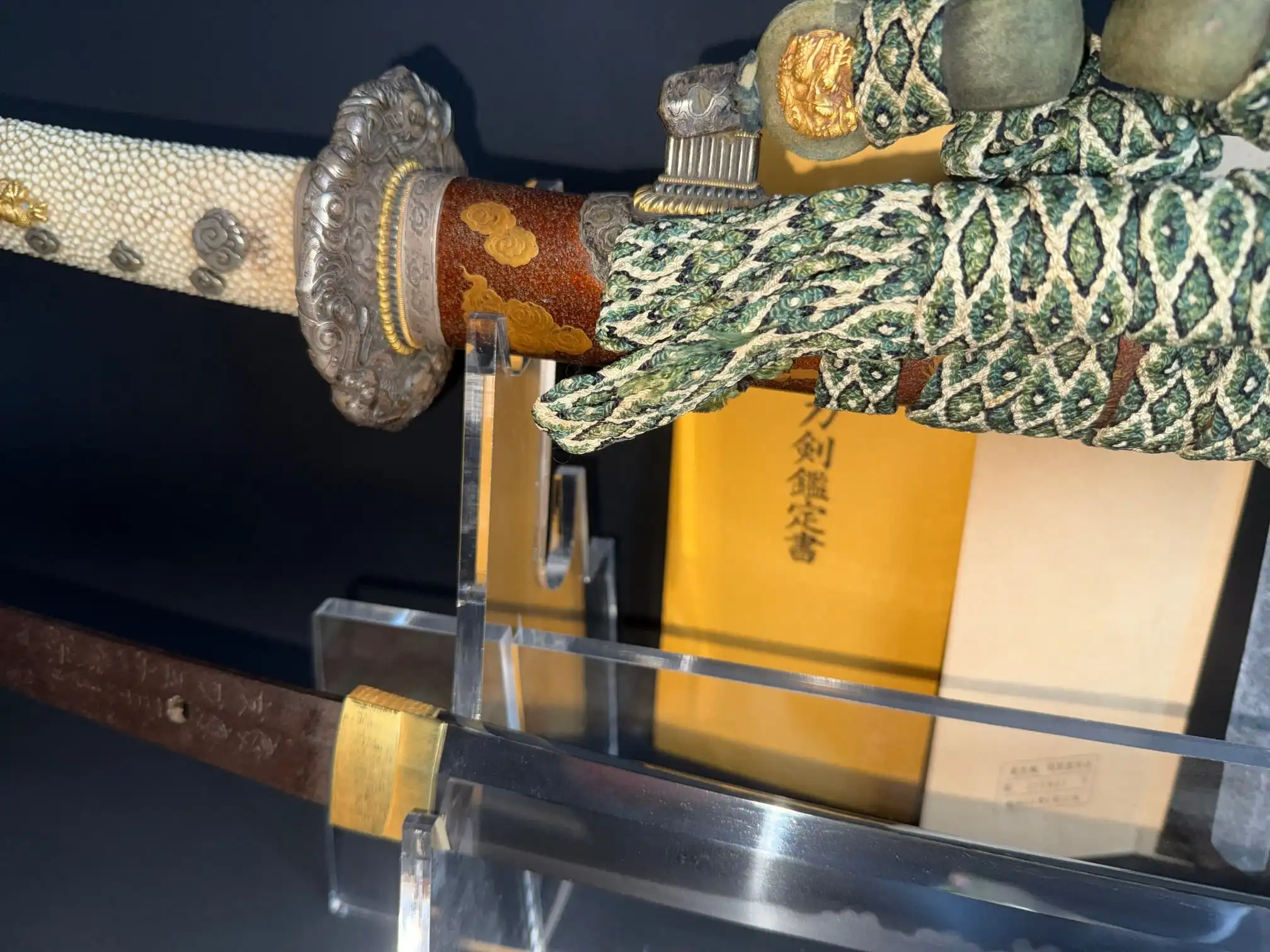 Tachi Yokoyama Sukekane Katana with ornate tsuka and partially visible blade displayed horizontally