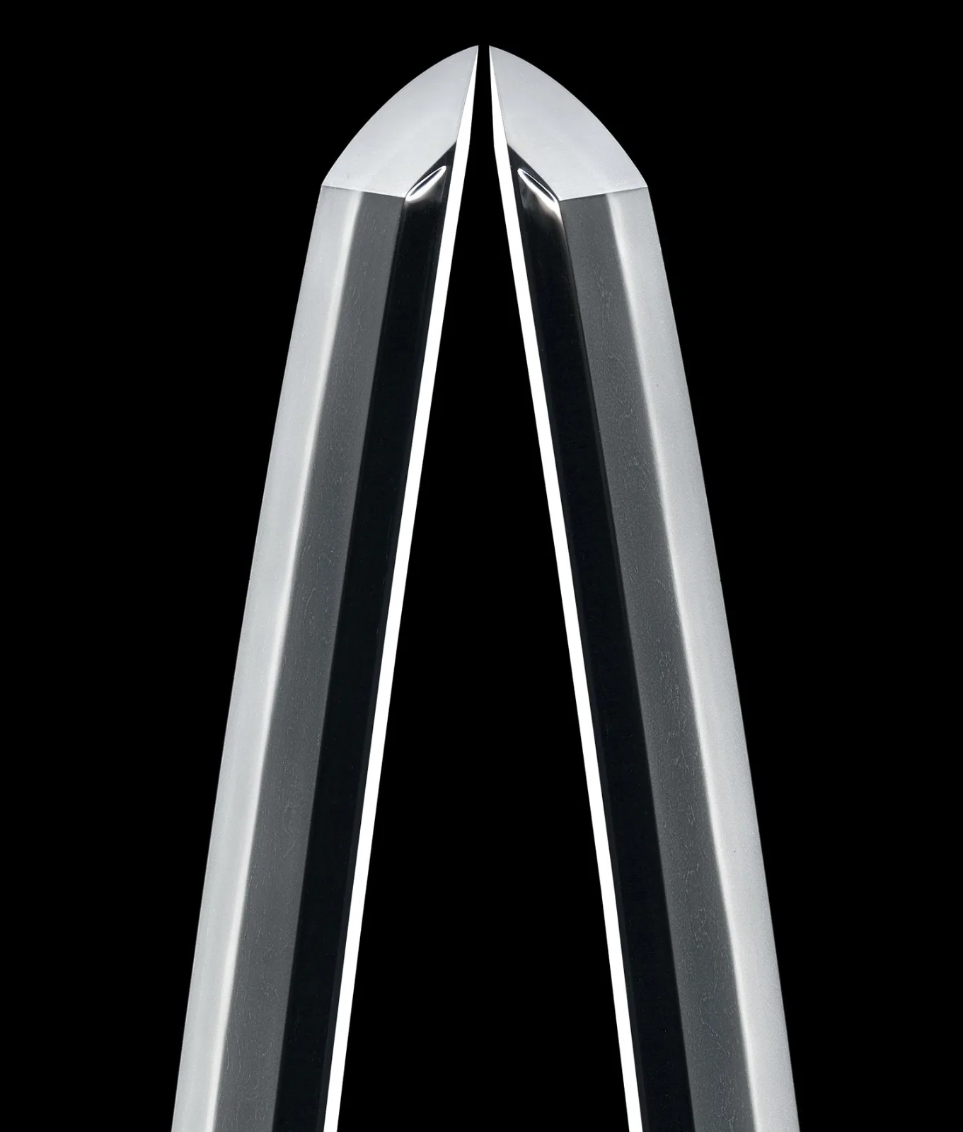 Close-up of two polished katana tips meeting, Tachi by Mukansa Swordsmith Hiroki Hirokuni.