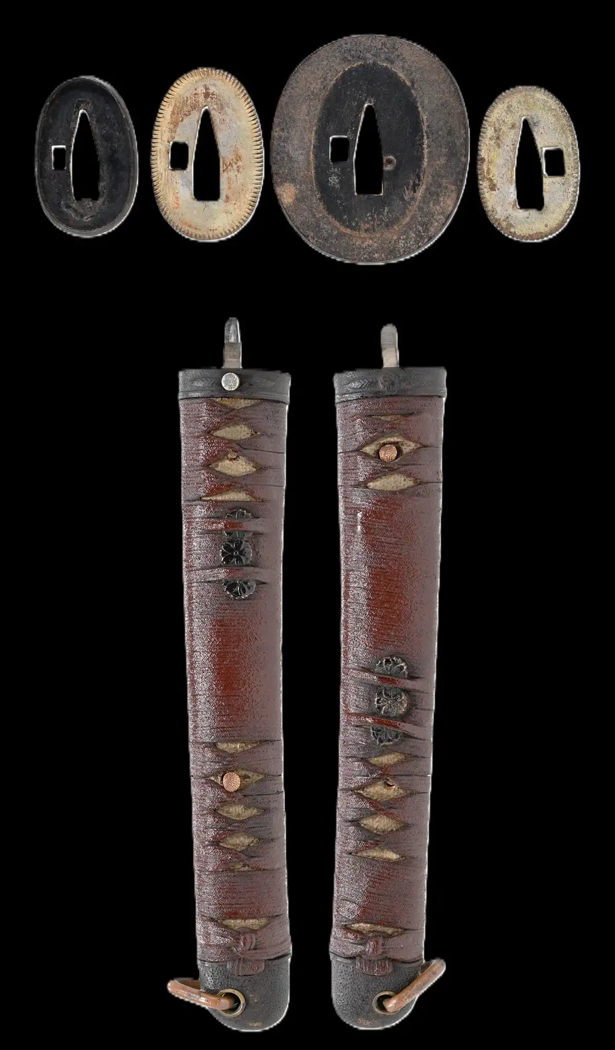 WWII Katana Ichihara Nagamitsu scabbards and tsuba with a weathered texture from above angled view