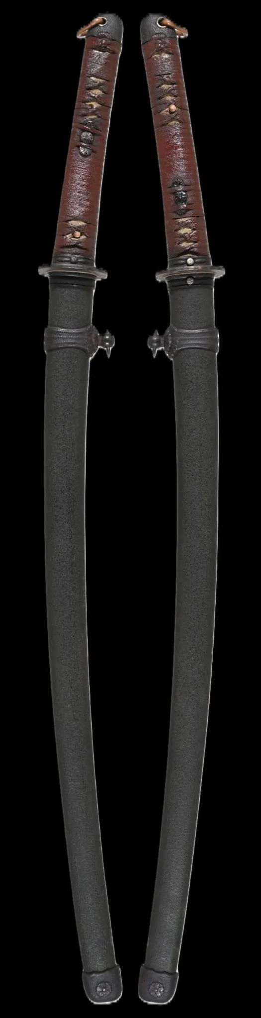 Two Kyodai Originals WWII Katana Ichihara Nagamitsu swords, wrapped hilt visible, set against a dark background.