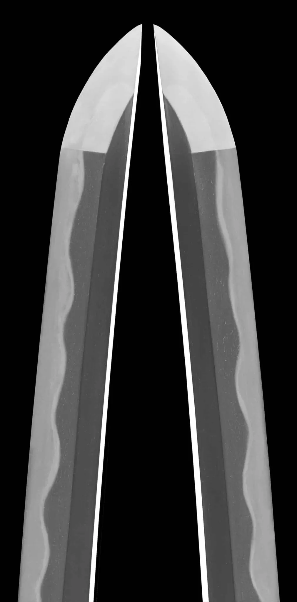 Close-up of the tip (kissaki) of a WWII Katana Ichihara Nagamitsu blade, showing the hamon pattern, Katana