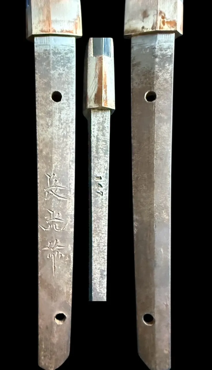 Close-up of the historical WWII Katana Ichihara Nagamitsu tang with visible kanji and serial numbers, a vintage Katana.