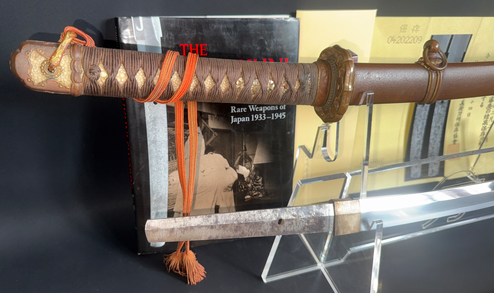 Complete Yasukuni Gendaitō Yasunobu Katana with detailed brown hilt and scabbard displayed on stand