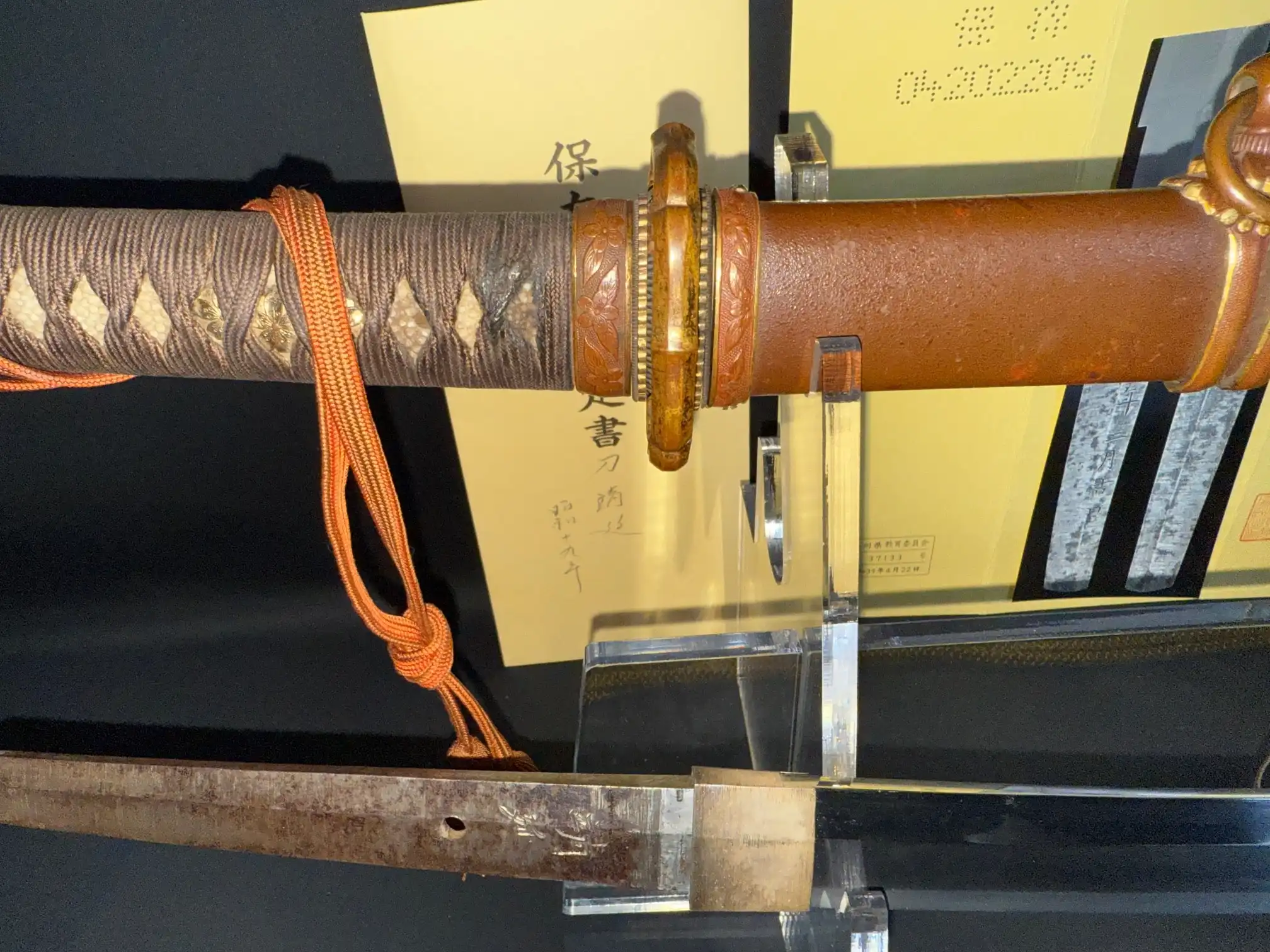 Yasukuni Gendaitō Yasunobu Katana with detailed brown hilt, partial blade, and Type 98 mounts