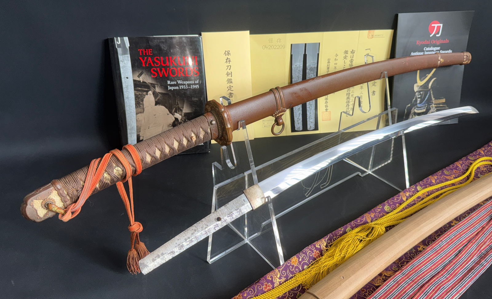Yasukuni Gendaitō Yasunobu katana with scabbard, blade, and hilt with brown wrap visible oblique view