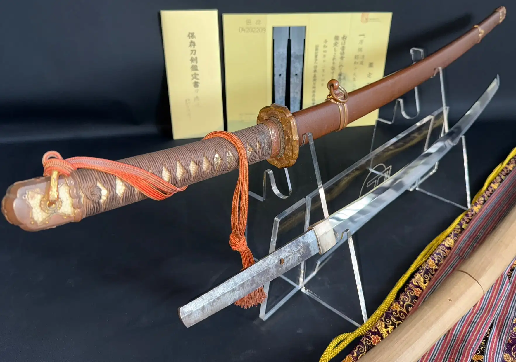 Kyodai Originals 1944 Yasukuni Gendaito Yasunobu katana, complete with Type 98 mounts, on display right.