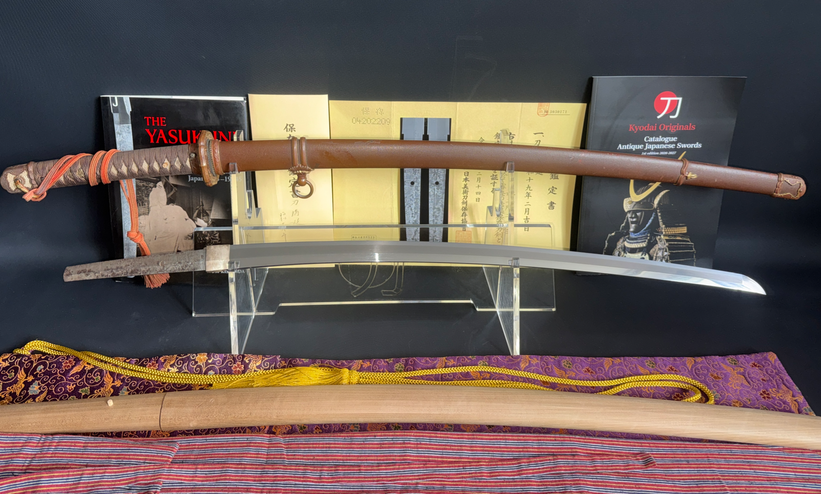 Yasunobu Yasukuni Gendaitō katana displayed with scabbard, mountings, and certification