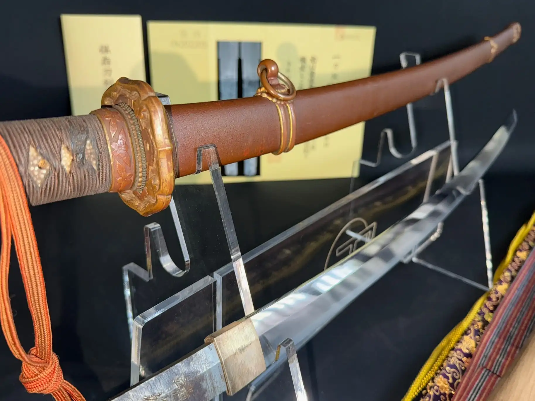 Close-up of a Yasukuni Gendaitō Yasunobu katana, showing detailed hilt and partial blade
