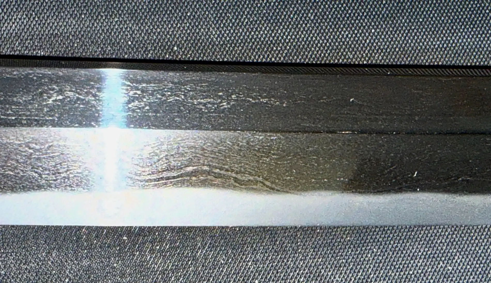 Close-up of Katana Bishū Tomo-jū Sadatsugu hamon and jigane showing intricate patterns on the blade of this katana
