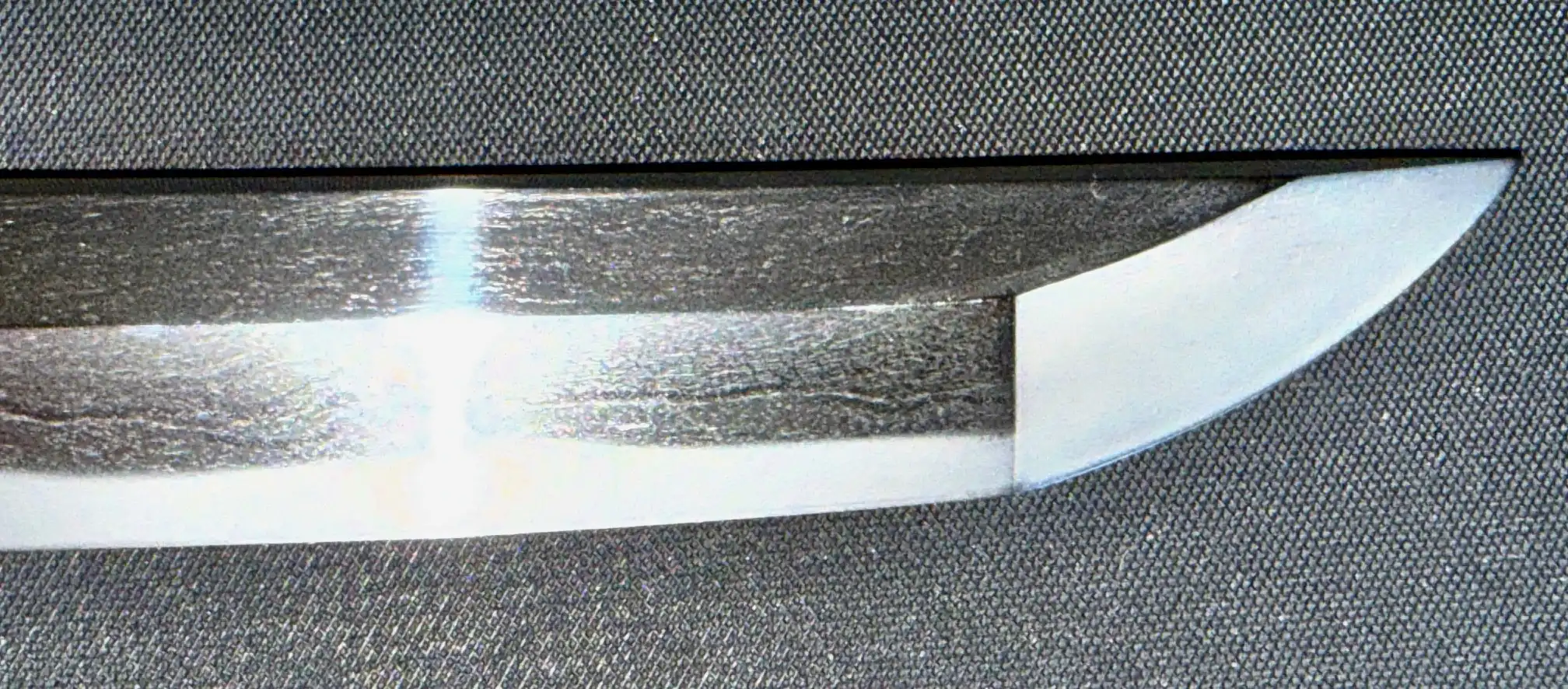 Katana Bishū Tomo-jū Sadatsugu, close-up of the polished kissaki (blade tip) showing the hamon and boshi.