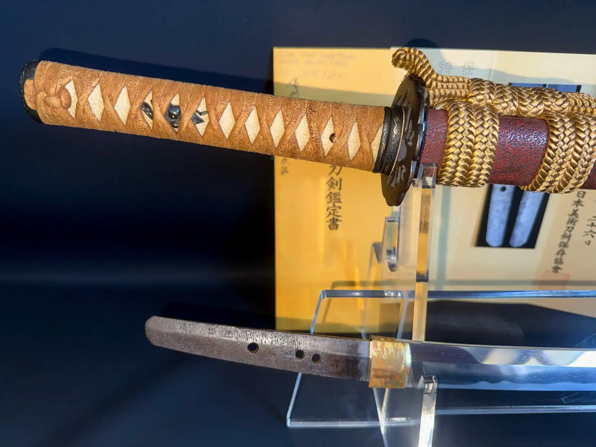 Close-up of Katana Bishū Tomo-jū Sadatsugu handle, tsuba, and tang with signature.