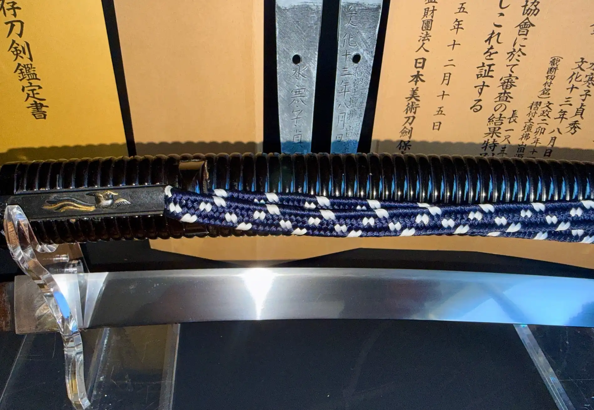 Suishinshi Masahide Wakizashi in stand, showing blade, hilt, and documents in background