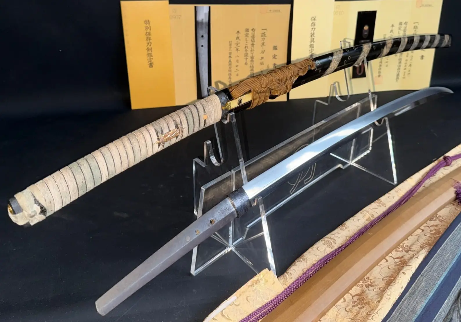 Aoe Nagamaki-Naoshi katana, Kamakura period, with shiny blade on stand and elaborate scabbard and hilt