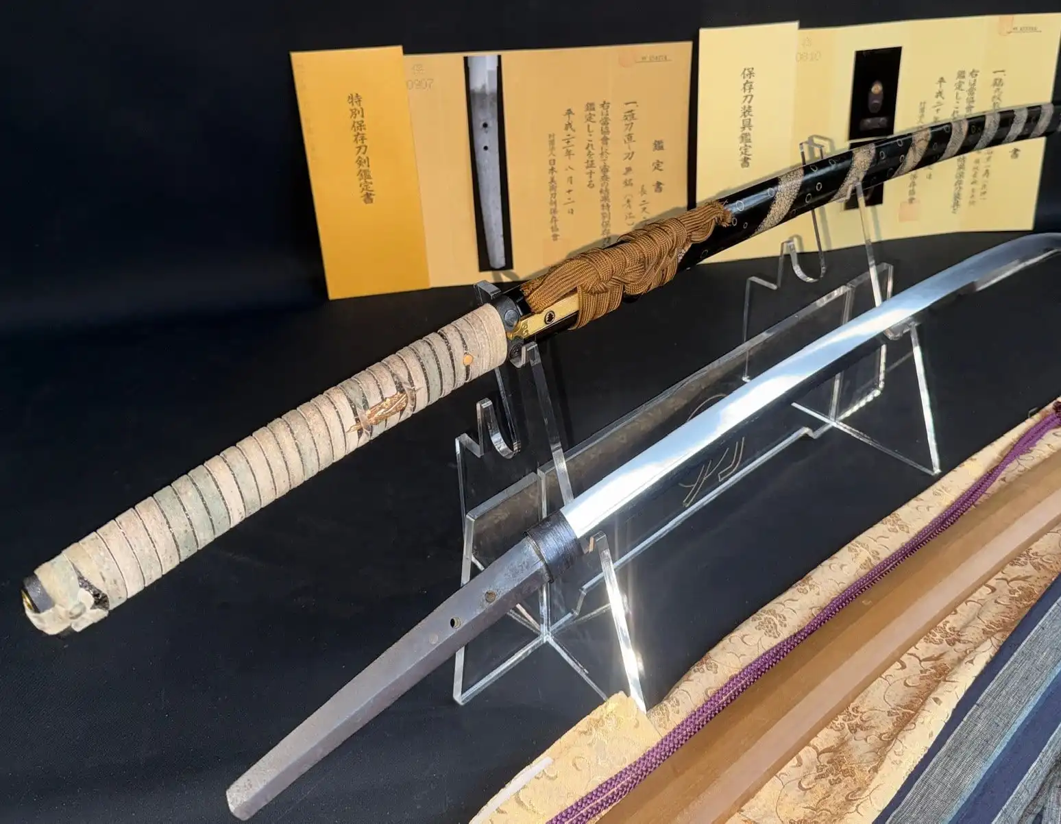 Aoe Nagamaki-Naoshi Kamakura period Katana, displayed on a stand with hilt and blade visible.