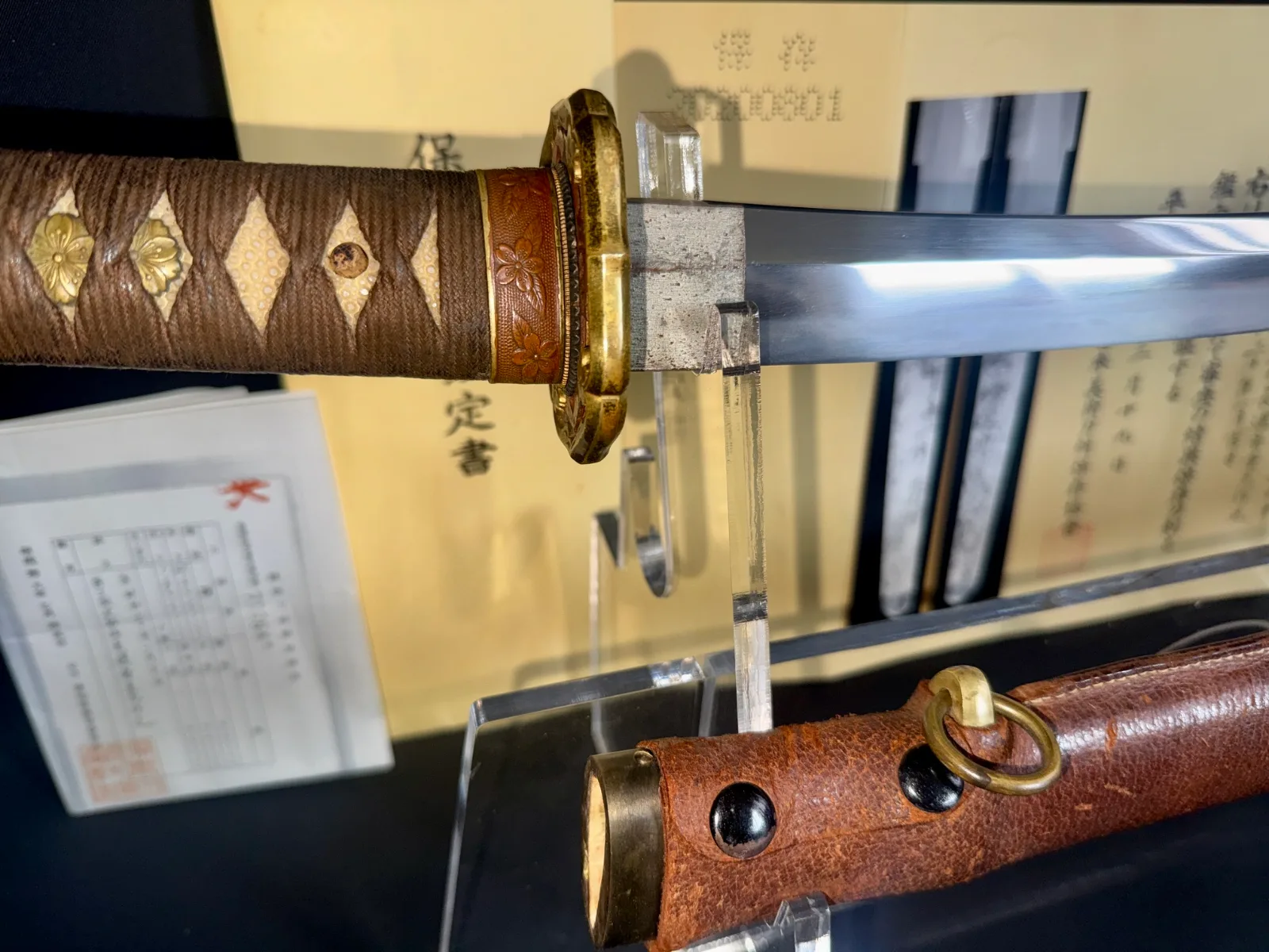 Close-up of a Chōunsai Shigemitsu katana with brown tsuka wrap & golden menuki, NBTHK certified Japanese sword
