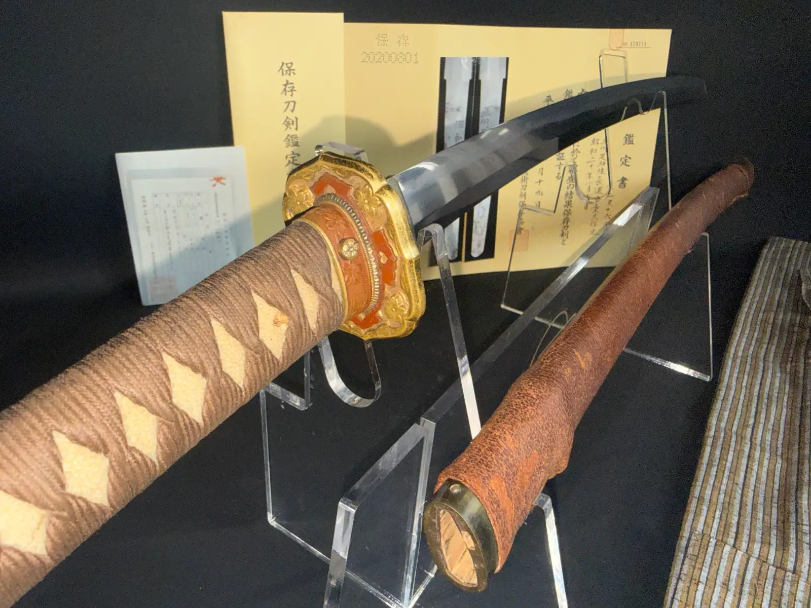Chōunsai Shigemitsu katana, angled from the hilt, visible blade and accompanying saya, NBTHK Hozon Certified Japanese sword