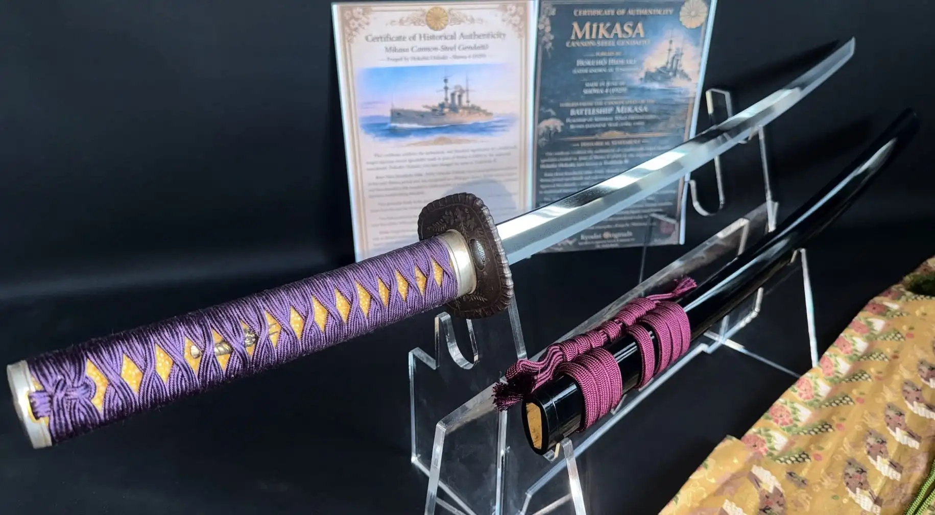 Gendaitō Battleship Mikasa katana with purple tsuka-ito, displayed next to its black saya.