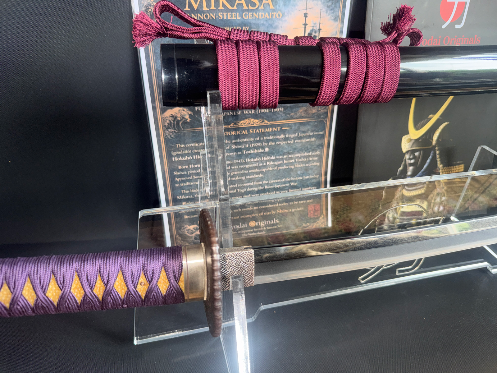 Gendaitō Battleship Mikasa katana, full view, with purple and yellow handle wrap & red saya cord