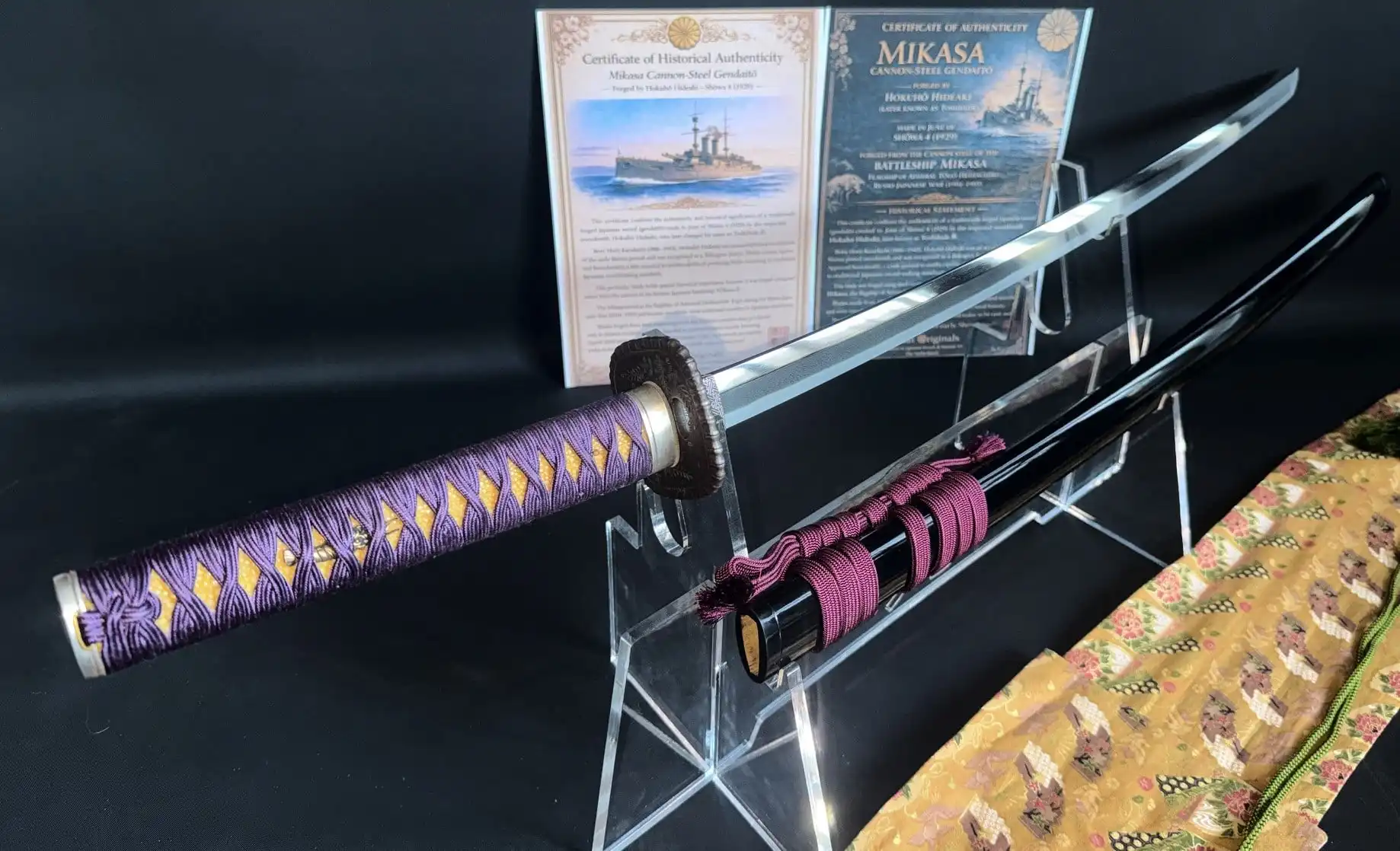 Gendaitō Battleship Mikasa katana, angled view showing blade, purple-wrapped hilt, and black scabbard.