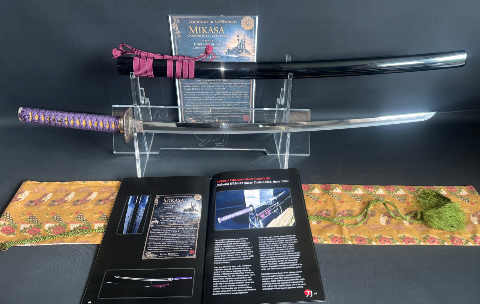 Gendaito Battleship Mikasa Katana, with vibrant purple tsuka and gleaming blade on display stand.