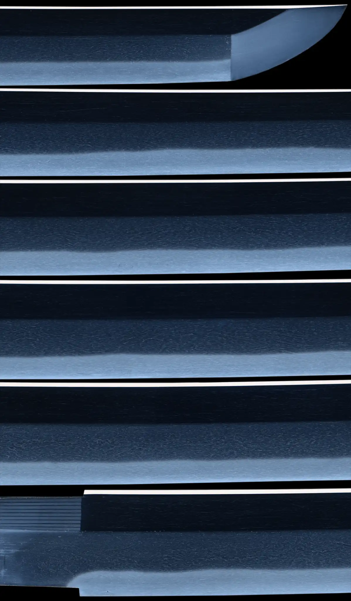 Close-up of the Gendaitō Battleship Mikasa katana blade showing the hamon and grain detail