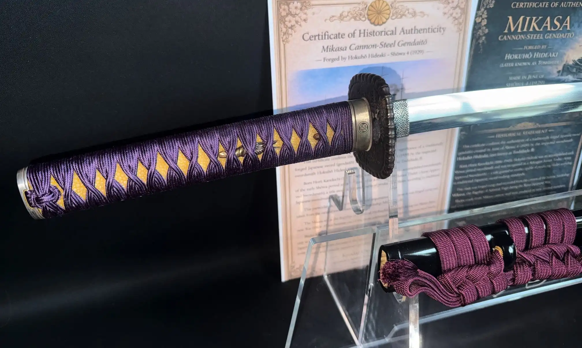 Katana Gendaitō Battleship Mikasa, purple and gold handle with detailed wrap, certificate of authenticity behind