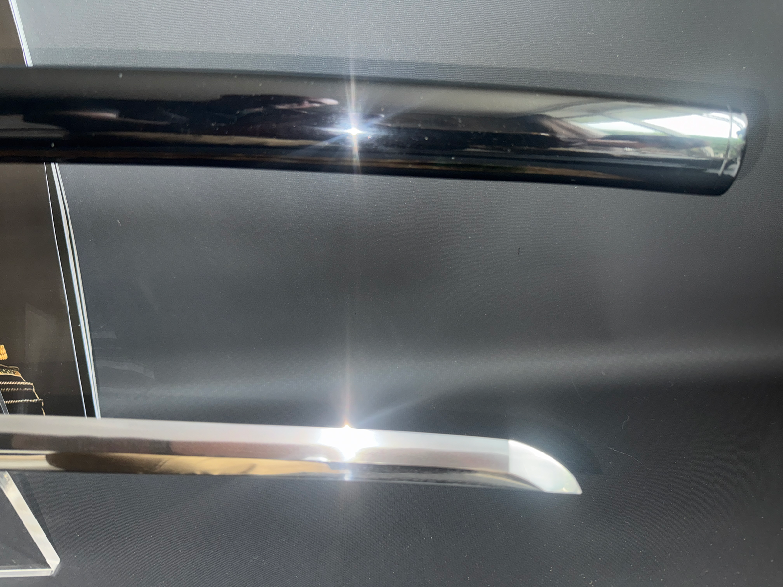 Close-up of a Kyodai Originals Gendaitō Battleship Mikasa Katana blade, sharp tip (kissaki) visible.