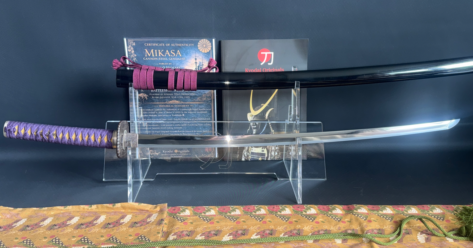 Kyodai Originals Gendaitō Battleship Mikasa Katana with purple tsuka and gleaming blade, laid next to its scabbard.