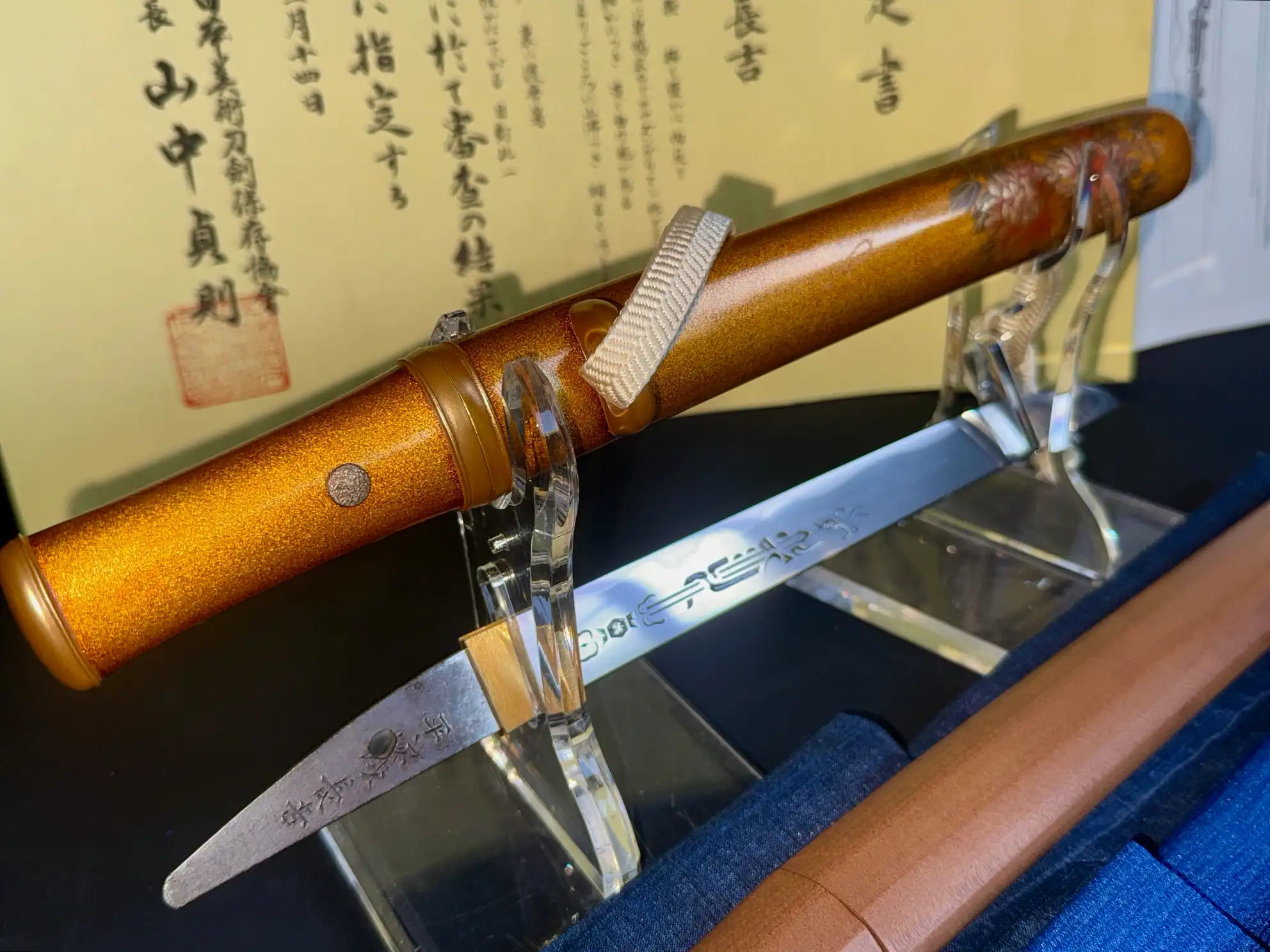 NBTHK Jūyō Tōken Tantō by Heianjō Nagayoshi, with iridescent scabbard and signed blade, on display.