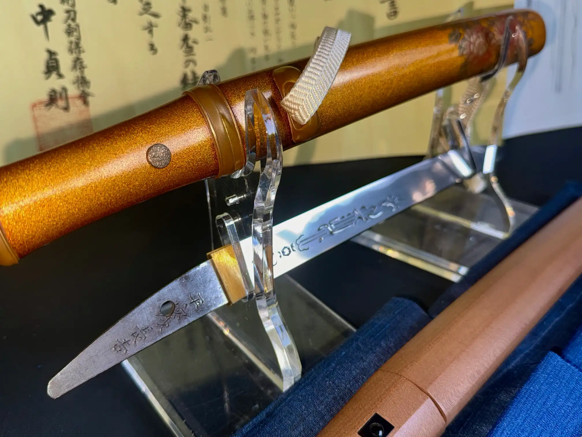 Close-up of the NBTHK Jūyō Tōken Tantō by Heianjō Nagayoshi, showing inscription on the blade and hilt