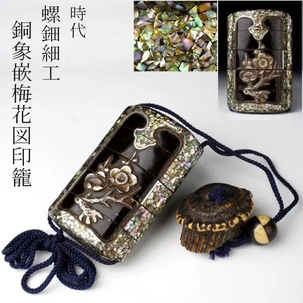 Edo Japanese Inro accessory with mother-of-pearl inlay and bronze plum blossoms, an intricate multi-tiered box