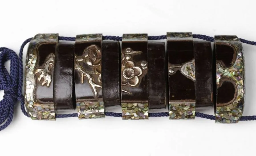 Edo Japanese Inro accessory, dark lacquer compartments featuring silver floral inlay and iridescent shell trim
