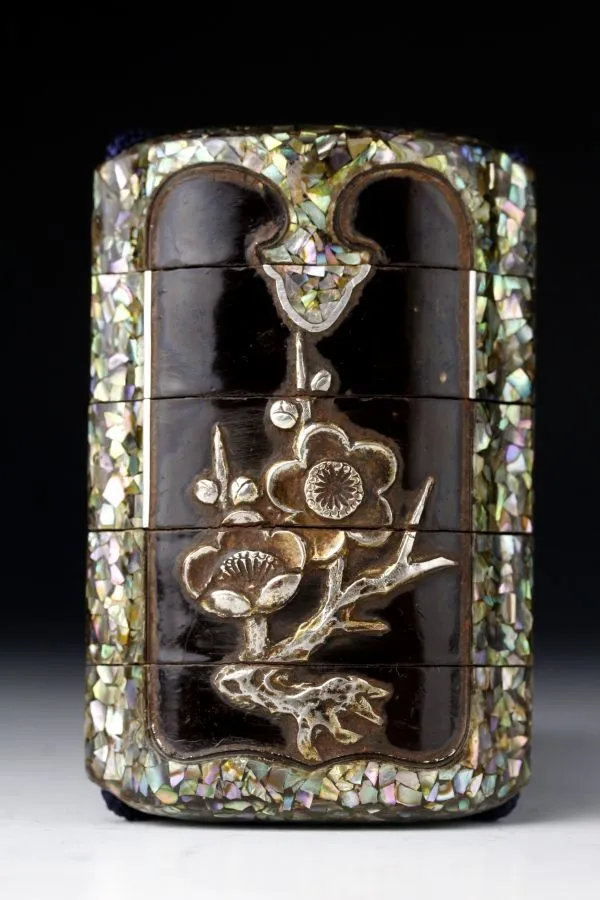 Edo Japanese Inro accessory, front view of ornate tiered case with shell inlay and metal floral details.