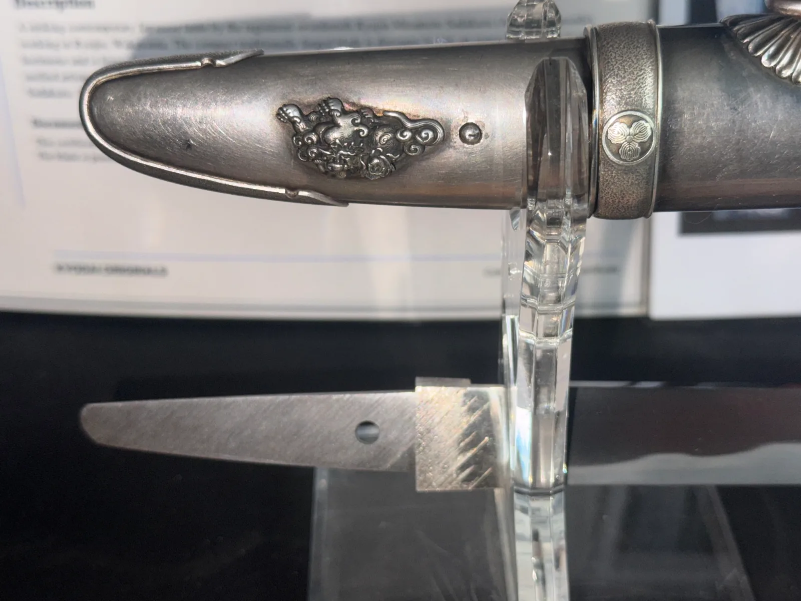 Close-up of Silver Skull Tanto by Ryūjin Minamoto Sadakazu, showing silver scabbard detail and bare tantō blade base