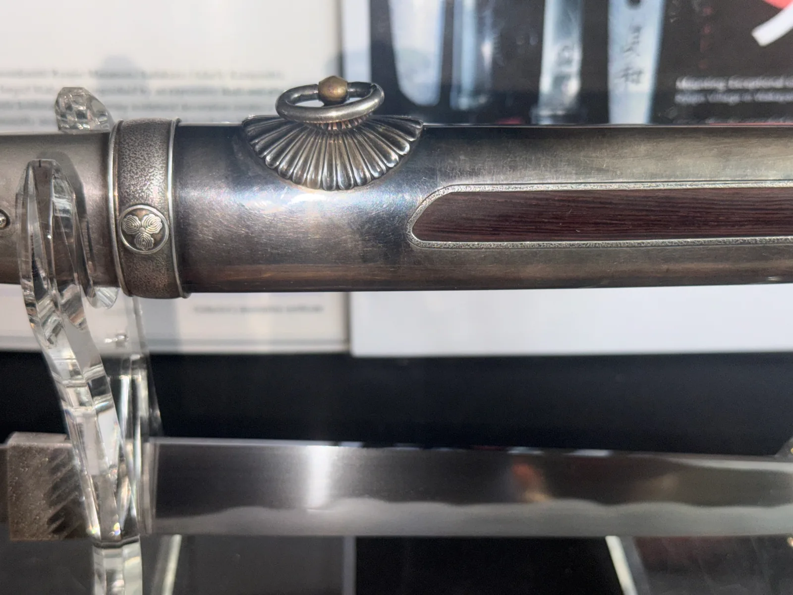 Silver Skull Tantō by Ryūjin Minamoto Sadakazu, close-up of the silver sheath with decorative ring and wood inlay