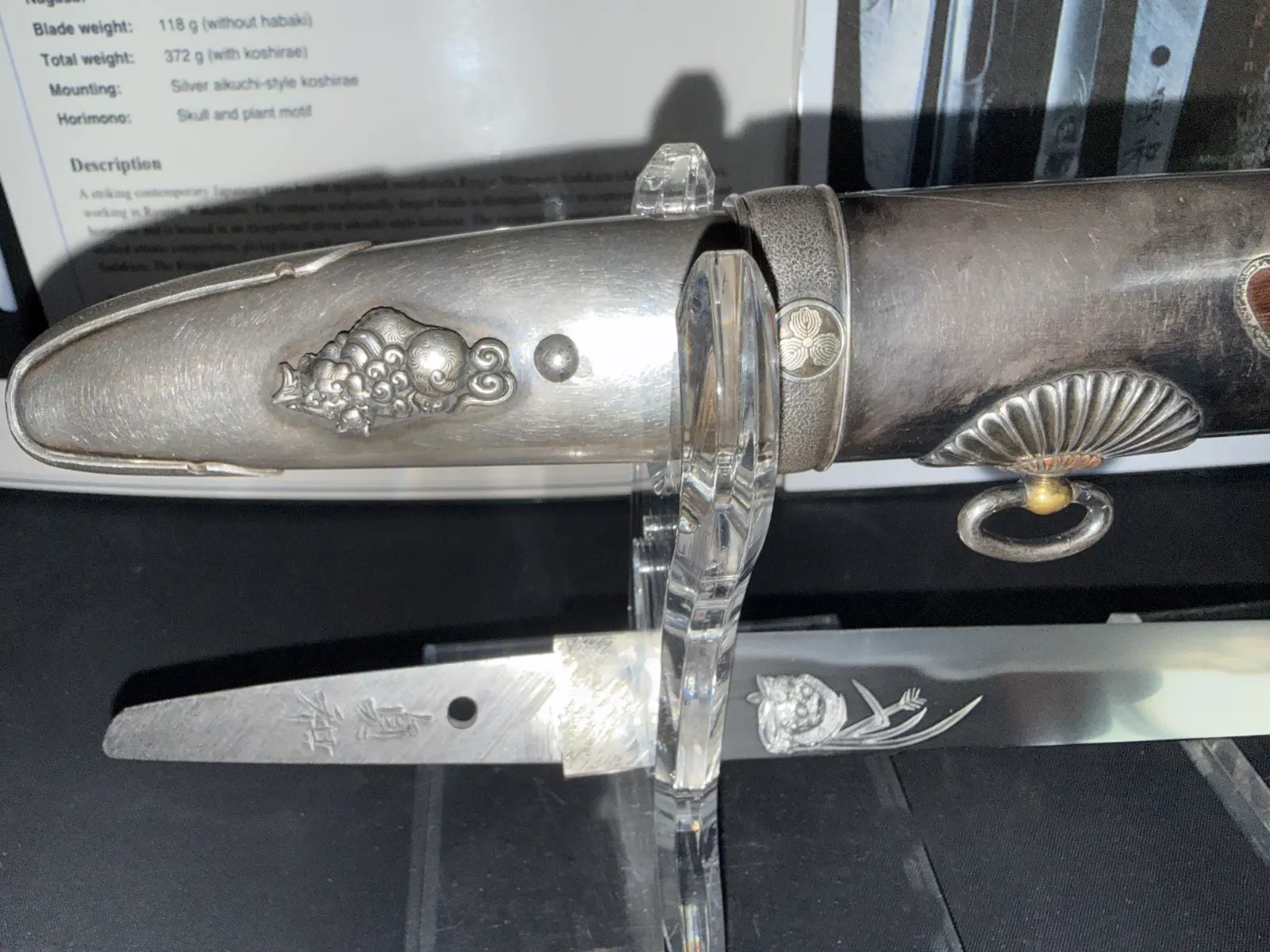 Silver Skull Tantō by Ryūjin Minamoto Sadakazu, closeup of silver koshirae and horimono blade, side angle