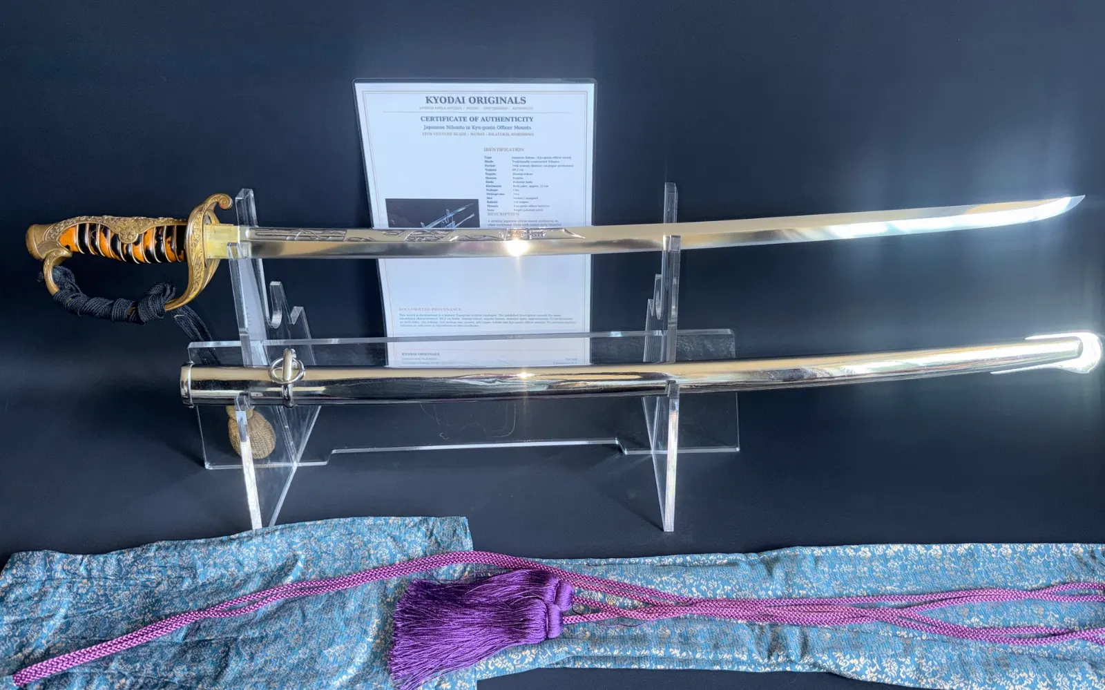 Japanese General Officer's Kyū-Guntō katana on stand, showing the detailed Gassan School Nihontō blade and hilt.